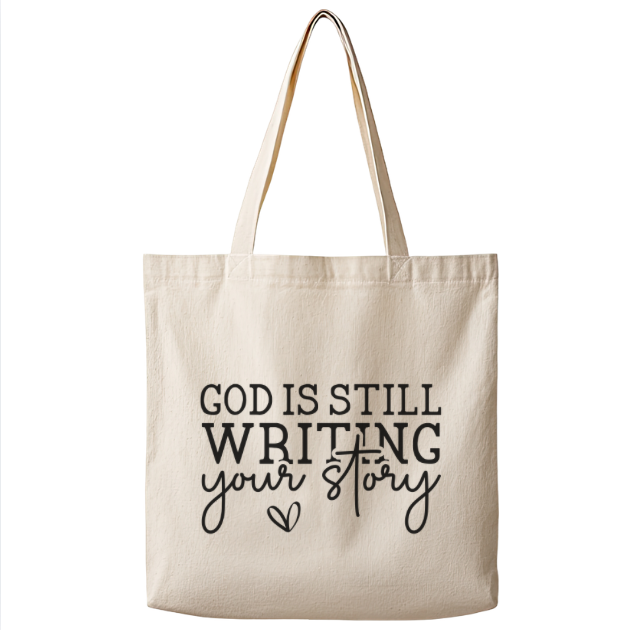God Is Still Writing Your Story – Canvas Tote Bag