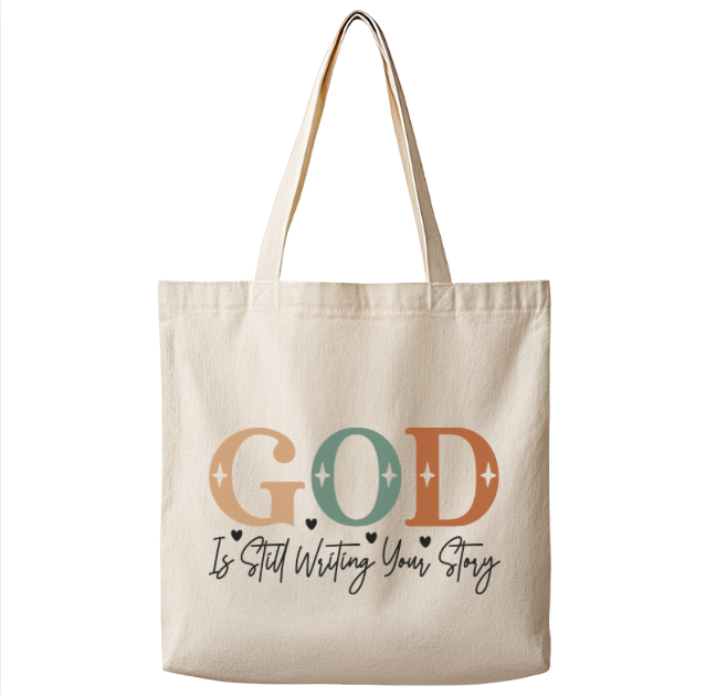 God Is Still Writing Your Story – Canvas Tote Bag